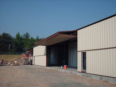 two Erect-a-Tube buildings that containing 8 nested T-Hangars each - Rockingham County Airport