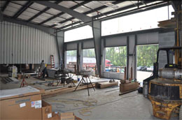 Loading dock doors and gas piping for heaters being installed.